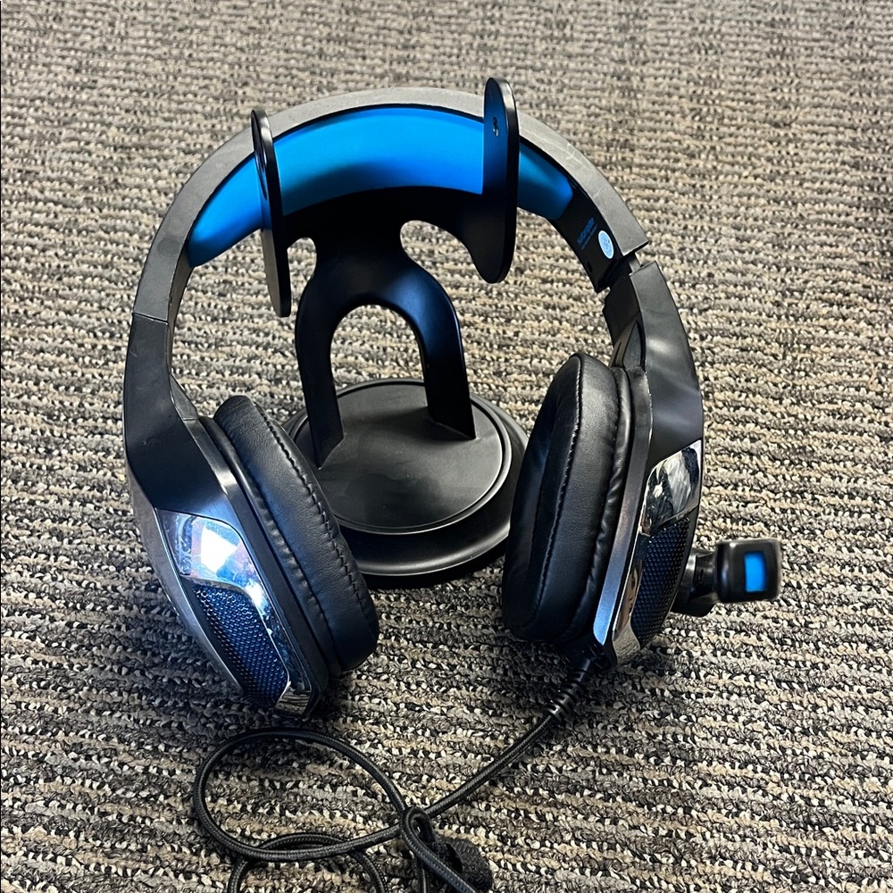 Sleek Black and Blue Gaming Headset with Stand